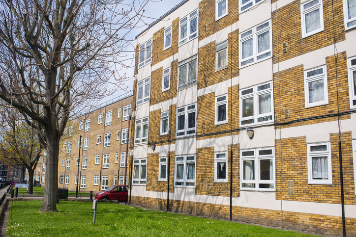A block of flats with trees in front