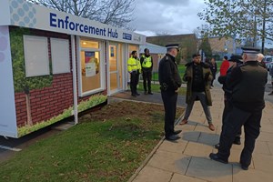 Police and residents outside Hainault hub 
